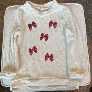 Cream sweater with pink bows